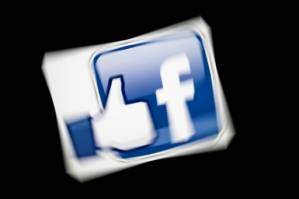 A day not to 'like' for Facebook, hit by outage, criminal probe.jpg