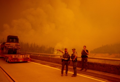 California battles largest-ever fire as eight killed in western US