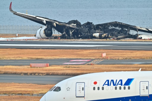 Japan investigators probe conflicting reports on fiery Tokyo crash