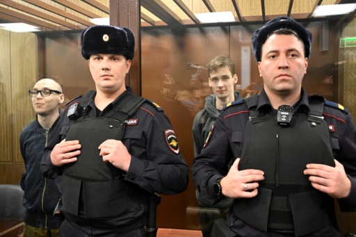 Two Russians get prison terms for poetry against Ukraine campaign