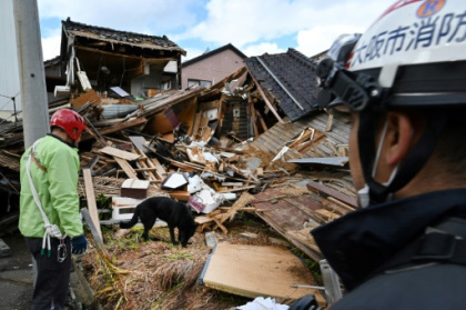 Ruin and rescue dogs in quake-ravaged Wajima.jpg