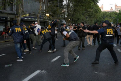 Argentine police battle protesters opposed to sweeping reform bill.jpg