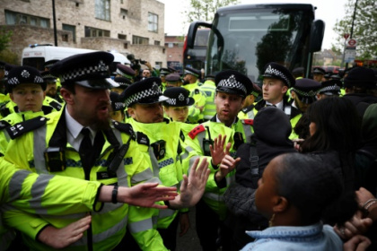 Protesters try to stop UK migrant removals from temporary accommodation.jpg