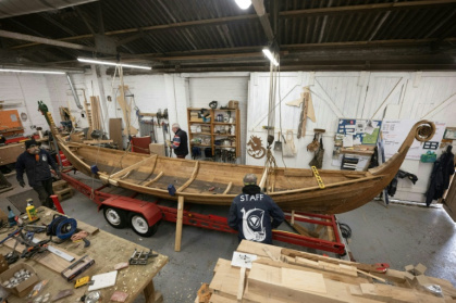 Veterans put the finishing touches to a Viking longboat built from solid oak using authentic Scandinavian plans as part of a project to help restore their mental health
