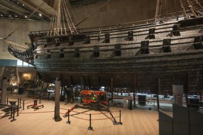 Workers install a new metallic support structure around the 17th-century warship Vasa at the Vasa Museum in Stockholm