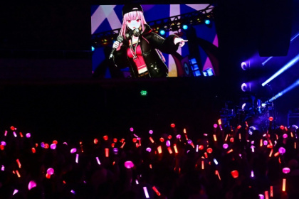 Fans waved glow sticks at an animated character on stage, having packed a sold-out concert hall to see VTuber Mori Calliope perform