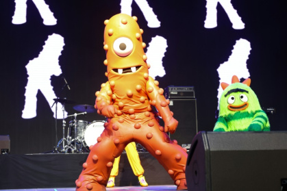 Muno, one of the main members of 'Yo Gabba Gabba!', performs with Broobee (R) during the 2025 Coachella festival in the California desert