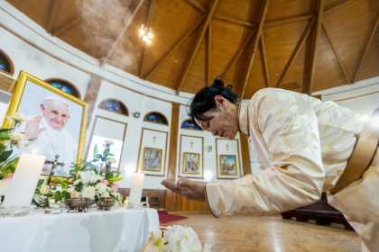 A woman attends a memorial mass to pay tribute to the late Pope Francis at Saints Peter and Paul Cathedral in Ulaanbaatar, the capital of Mongolia