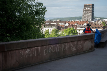Graffiti in Basel ahead of the Eurovision Song Contest, where politics is officially barred - Fabrice COFFRINI (AFP)