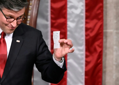 US House Speaker Mike Johnson shows the final tally of the vote on President Donald Trump's tax bill on the floor of the House of Representatives - Alex WROBLEWSKI (AFP)