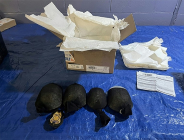 A handout image released by the District Court for the Western District of New York from the United States Fish and Wildlife Service shows the sock-wrapped protected turtles intercepted during a border inspection - - (AFP)