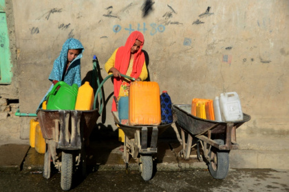 The report found that in most countries with available data, women and girls were chiefly responsible for water collection - Javed TANVEER (AFP)