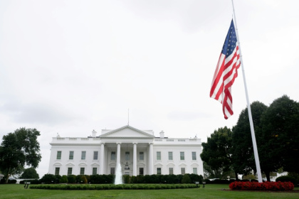 The US flag flies at half-staff outside the White House to honor conservative commentator Charlie Kirk - SAUL LOEB (AFP)