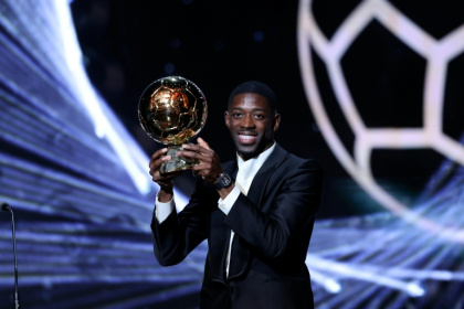 Paris Saint-Germain's Ousmane Dembele with the trophy after winning the men's Ballon d'Or on Monday - Franck FIFE (AFP)