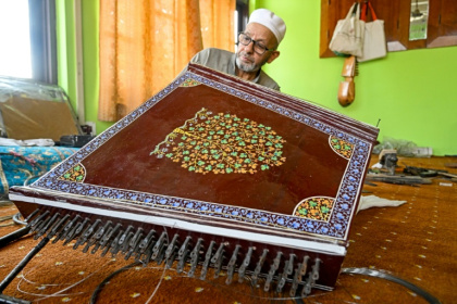 Generations of artisans in Indian-administered Kashmir have been making musical instruments such as the santoor, a zither-like, hundred-stringed instrument - Tauseef MUSTAFA (AFP)