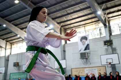 Iranian women are increasingly taking part in martial arts like karate amid tentative steps towards having greater public roles - ATTA KENARE (AFP)