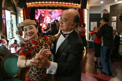 On any given day, multiple venues in Shanghai host hours-long dance sessions, a phenomenon born of the city's deeply of ballroom culture - Hector RETAMAL (AFP)