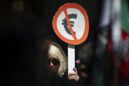 Bulgarians are divided on joining the euro, with 49 percent against adopting the currency according to the latest Eurobarometer survey - Nikolay DOYCHINOV (AFP)