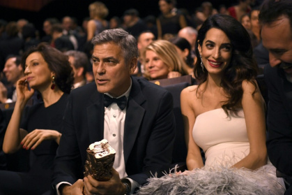 Actor George Clooney, who admits his French is 'bad', and wife Amal Clooney, who is fluent - bertrand GUAY (AFP)