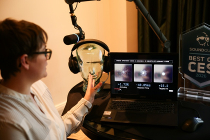 Neurable research scientist Alicia Howell-Munson demonstrates the company's headset, which it says can detect early signs of Alzheimer's disease - Patrick T. Fallon (AFP)