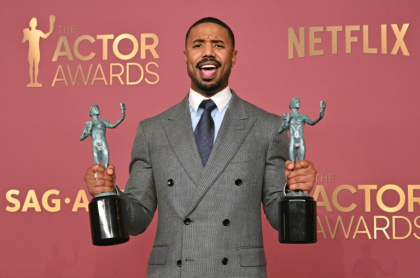 'Sinners' star Michael B. Jordan poses with his two Actor Awards -- for best cast and best male actor - Frederic J. Brown (AFP)