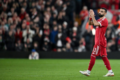 Mohamed Salah applauds as he leaves the pitch after being substituted during Liverpool's Champions League match against Galatasaray - Paul ELLIS (AFP)