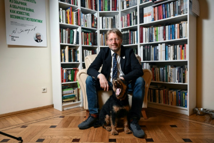 Yabloko's leader Nikolay Rybakov, seen here at the party's HQ with dog, vowed to keep on fighting - Igor IVANKO (AFP)