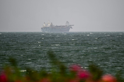 A vessel is seen off the coast of Sharjah in the United Arab Emirates on August 3, 2026. - - (AFP)